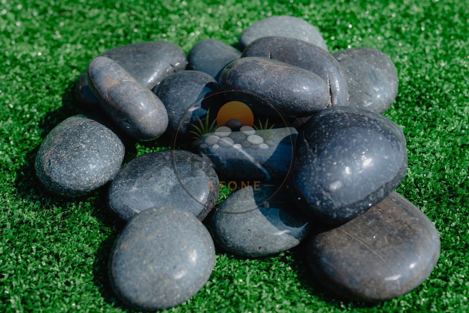 Black pebble stones for landscaping and decorative export supply